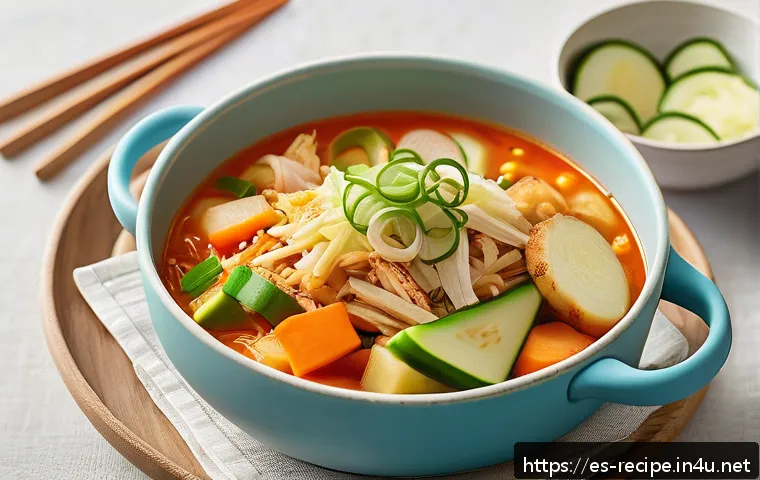 유아용 김치찌개 만드는 법 - A warm, gentle baby-friendly kimchi jjigae bowl served in a pastel-colored baby dish, featuring soft...